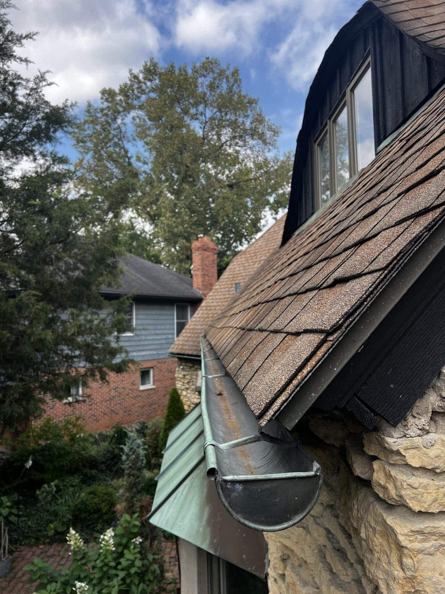 Half-round copper gutter repaired with professionally soldered connections