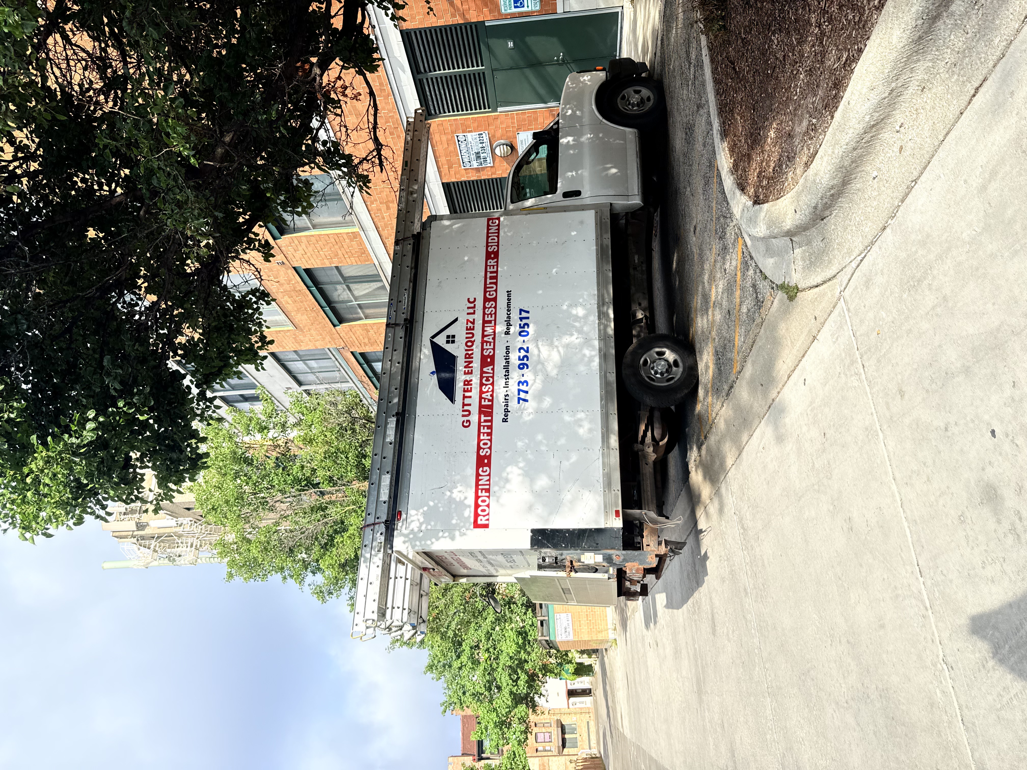 Chicago gutter contractor installing seamless gutters on residential home